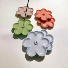 Load image into Gallery viewer, A collection of concrete flower-shaped incense holders in various colors, each with a central hole for holding incense sticks.
