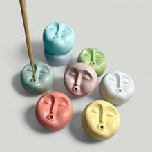 Load image into Gallery viewer, Set of colorful moon face-shaped incense holders on a light gray background
